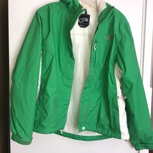 Green and white womens Northface rain jacket